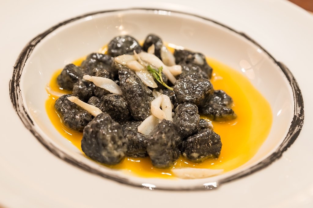 Squid ink gnocchi with sea bass and saffron sauce - Pinocchio's Pantry - Authentic Italian Food